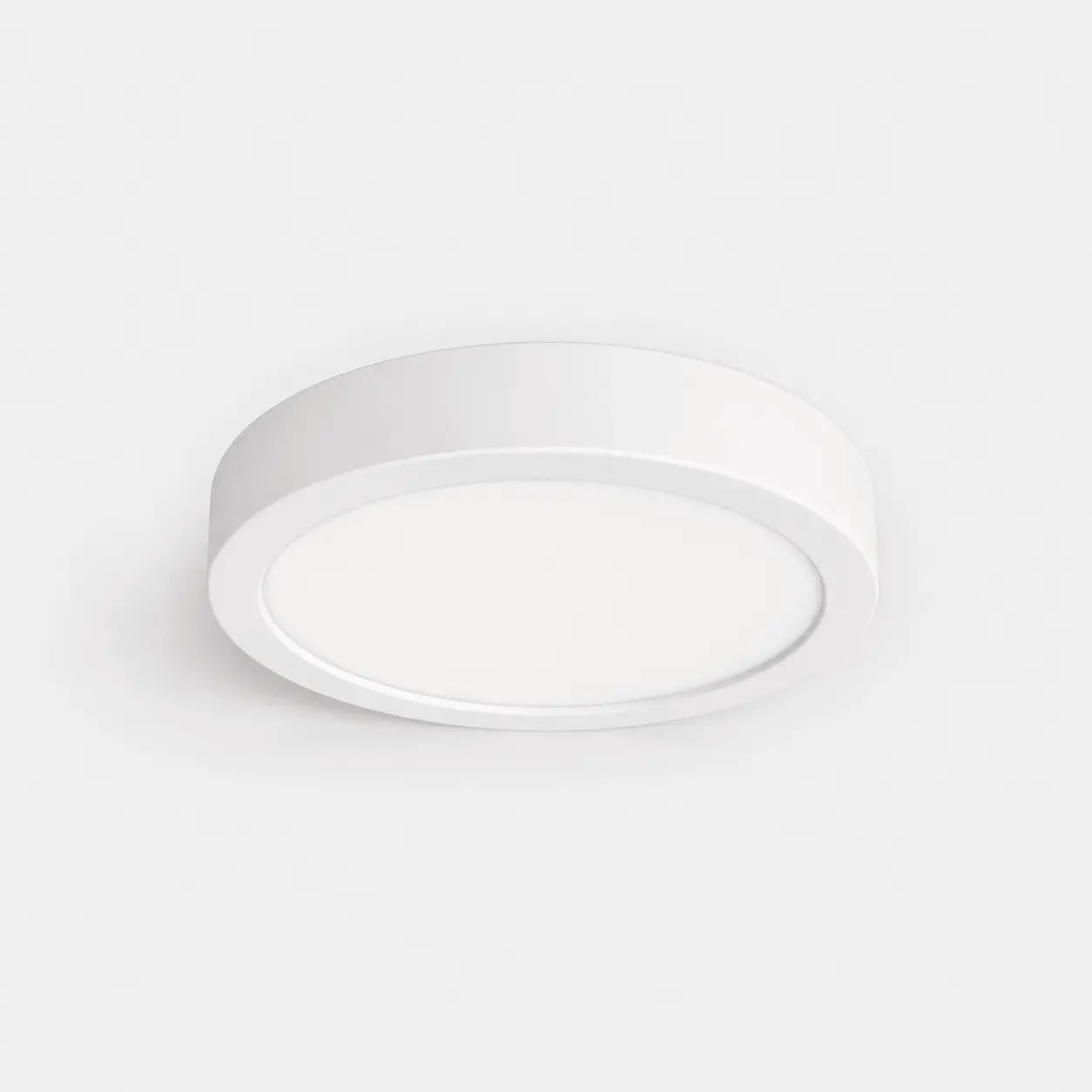 Round white ceiling light on a light gray background